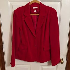 Women’s jacket/blazer red.  88% polyester, 12% nylon. Lining 100% polyester.